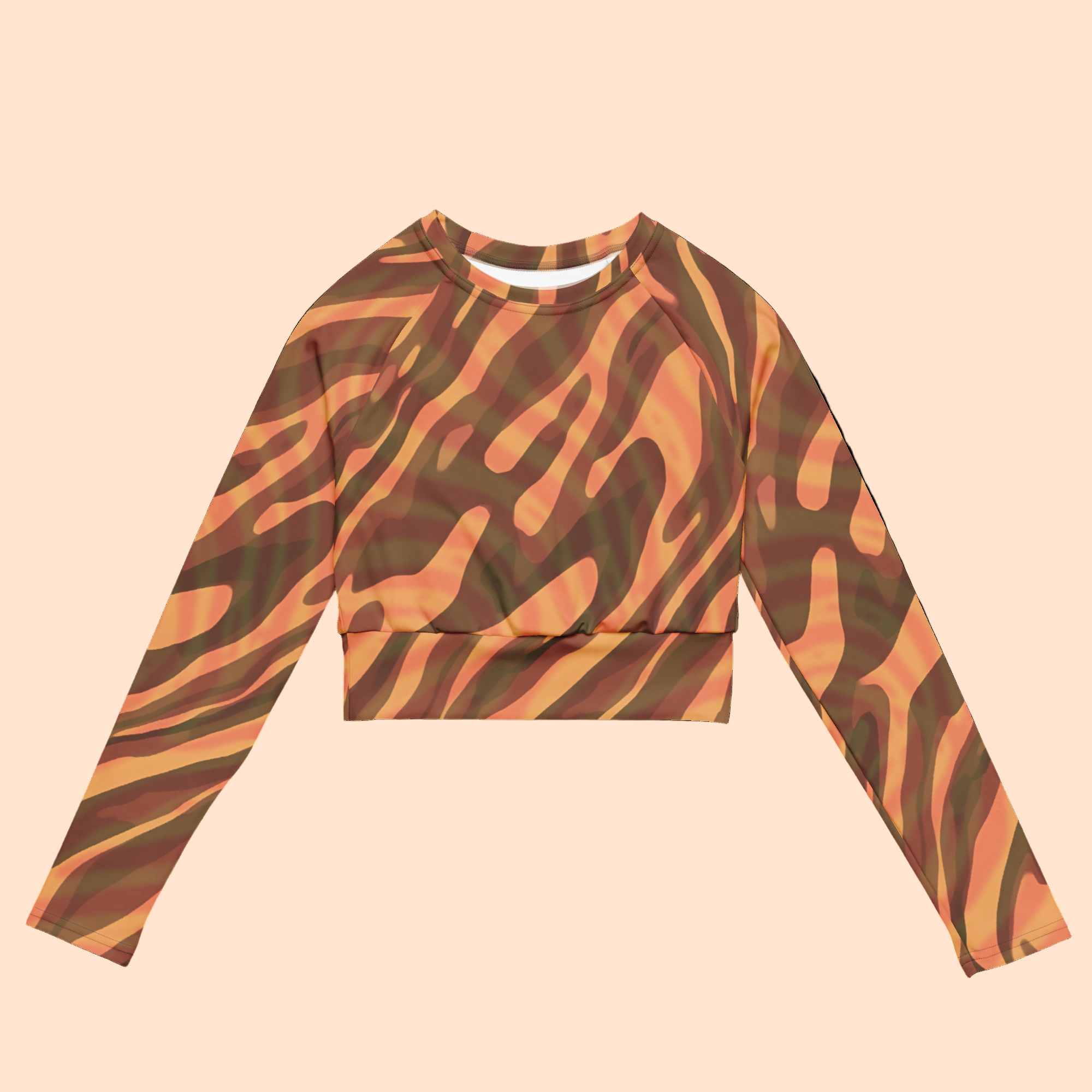 Zebra-patterned long-sleeve crop top on a cream background