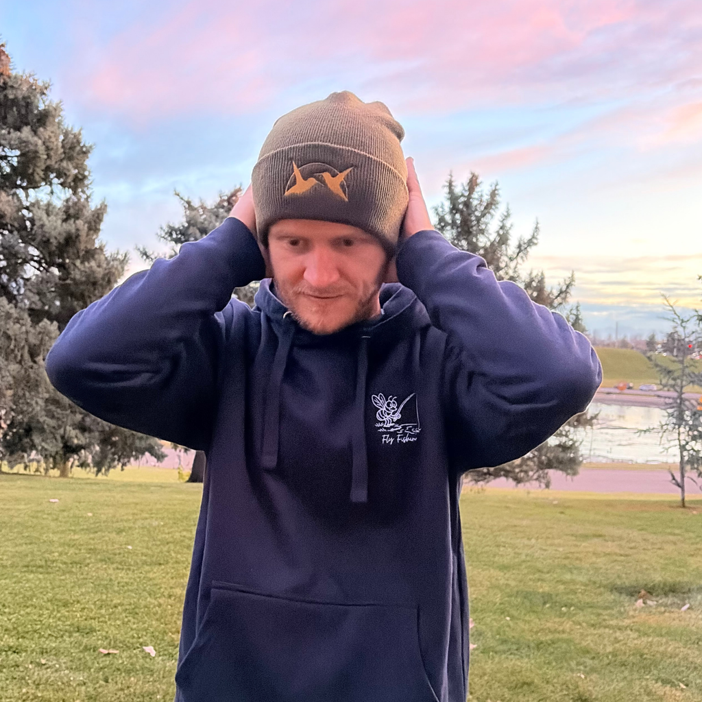 Black hoodie with fly fishing design and green beanie with hummingbirds.